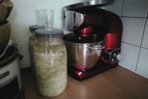 Jars are stored in a cool, dark place for fermentation.