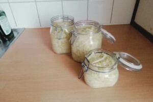 Sauerkraut are transfered into jars with seal for long-term storage in the fridge.