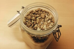 Granola has been transferred to an airtight container for storage.