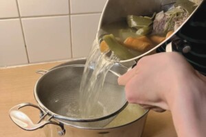 Colander or sieve is used to strain the stock into a large container.