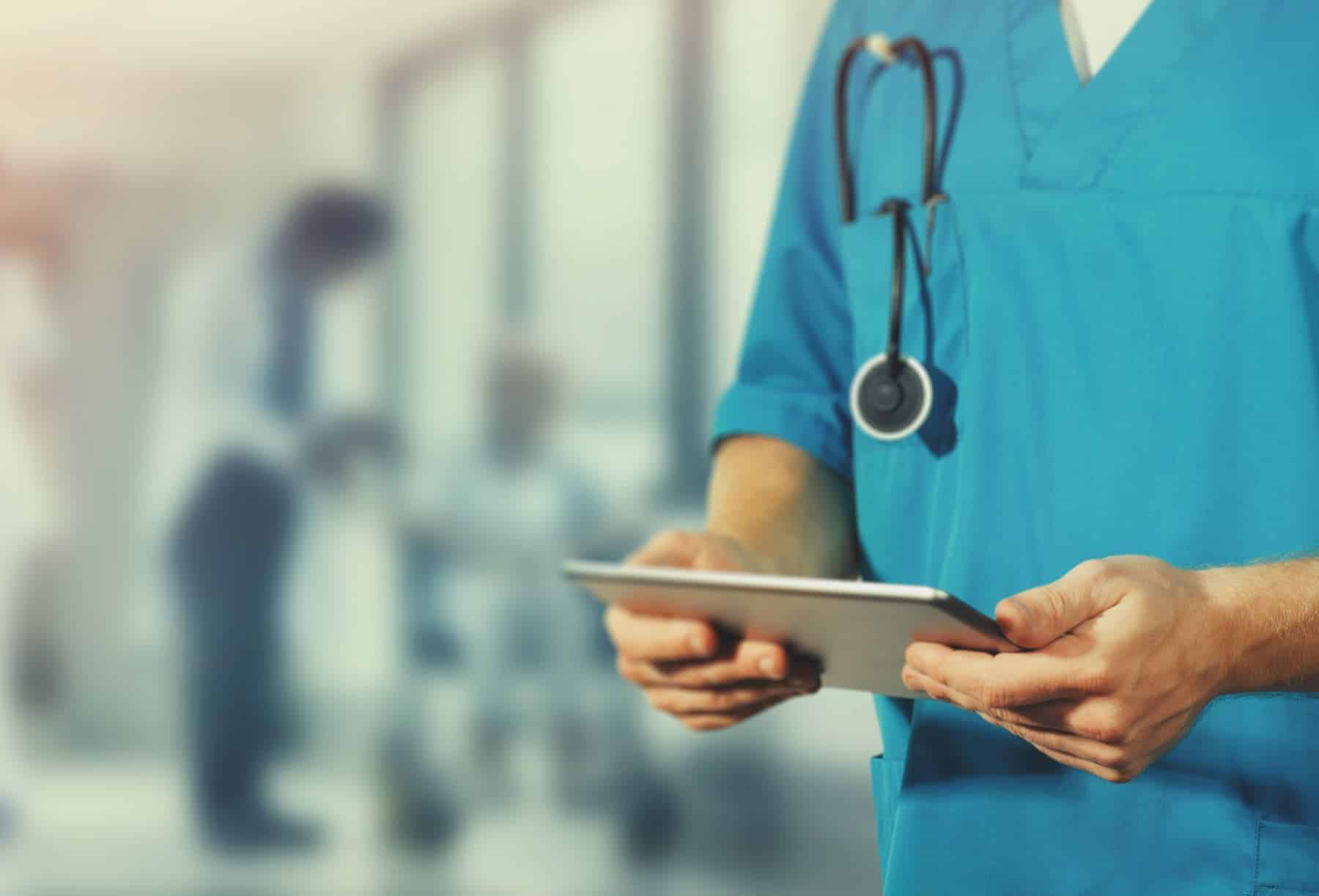 A doctor is depicted holding a digital tablet, highlighting that although ultra-processed food may seem more affordable at first, it can result in substantial healthcare costs in the future.
