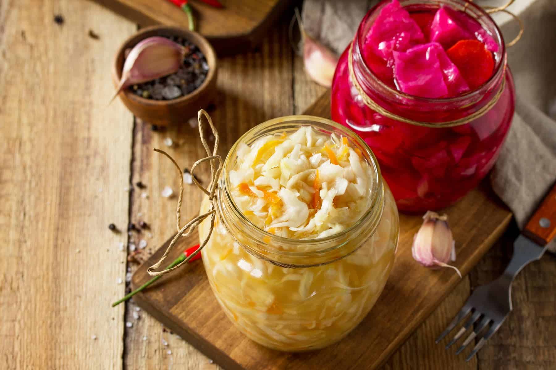 Sauerkraut in a glass jar, closeup.
