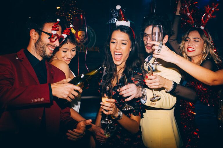Couples of friends celebrate New Year’s together with champagne, not thinking about how to avoid a hangover the next day.