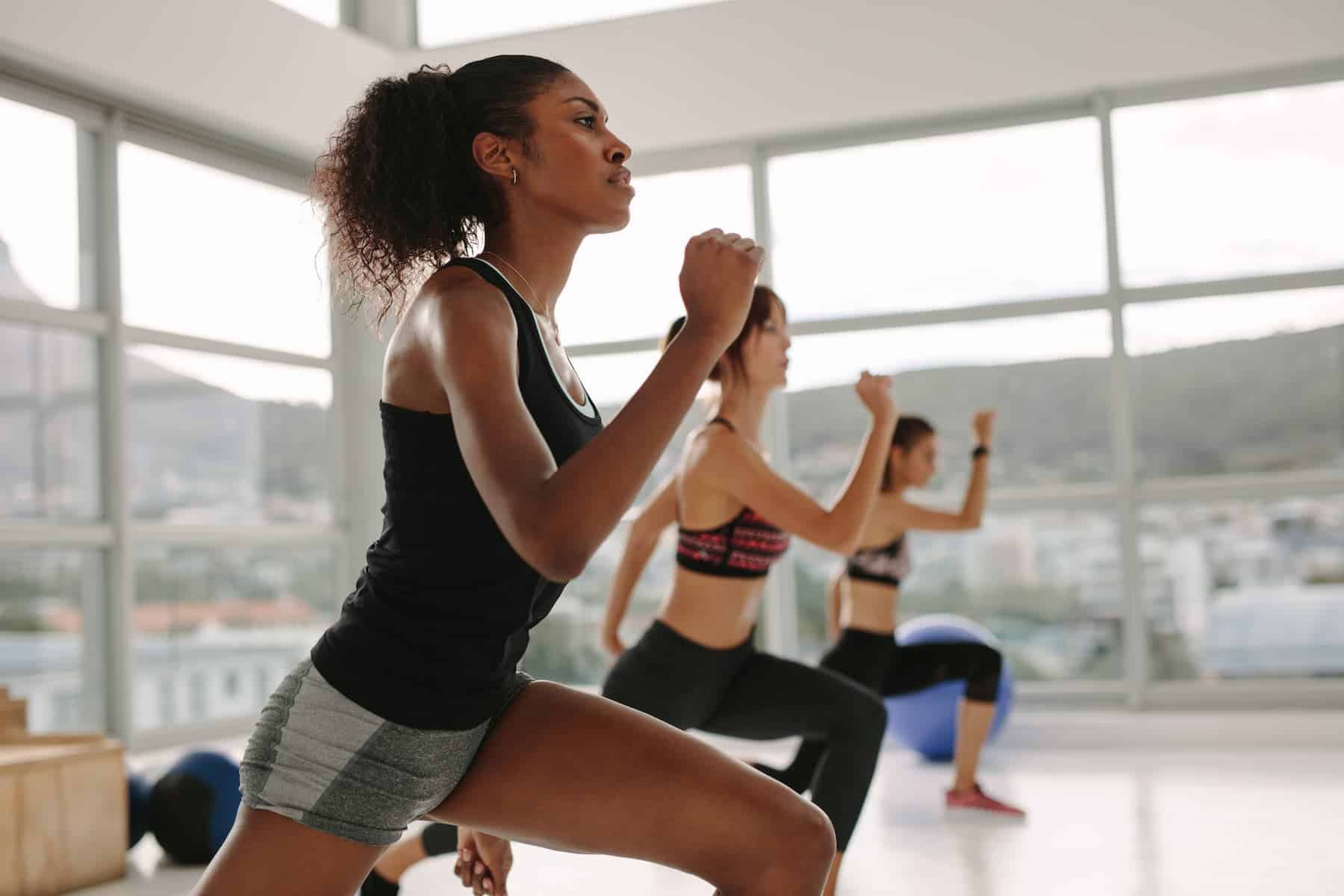 Women exercising together in a light-filled studio, reflecting strong exercise motivation among women.