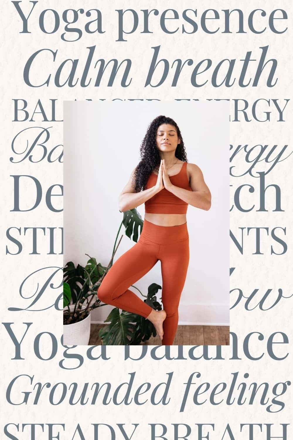 Woman in burnt orange yoga outfit stretching with eyes closed in a calm indoor setting.