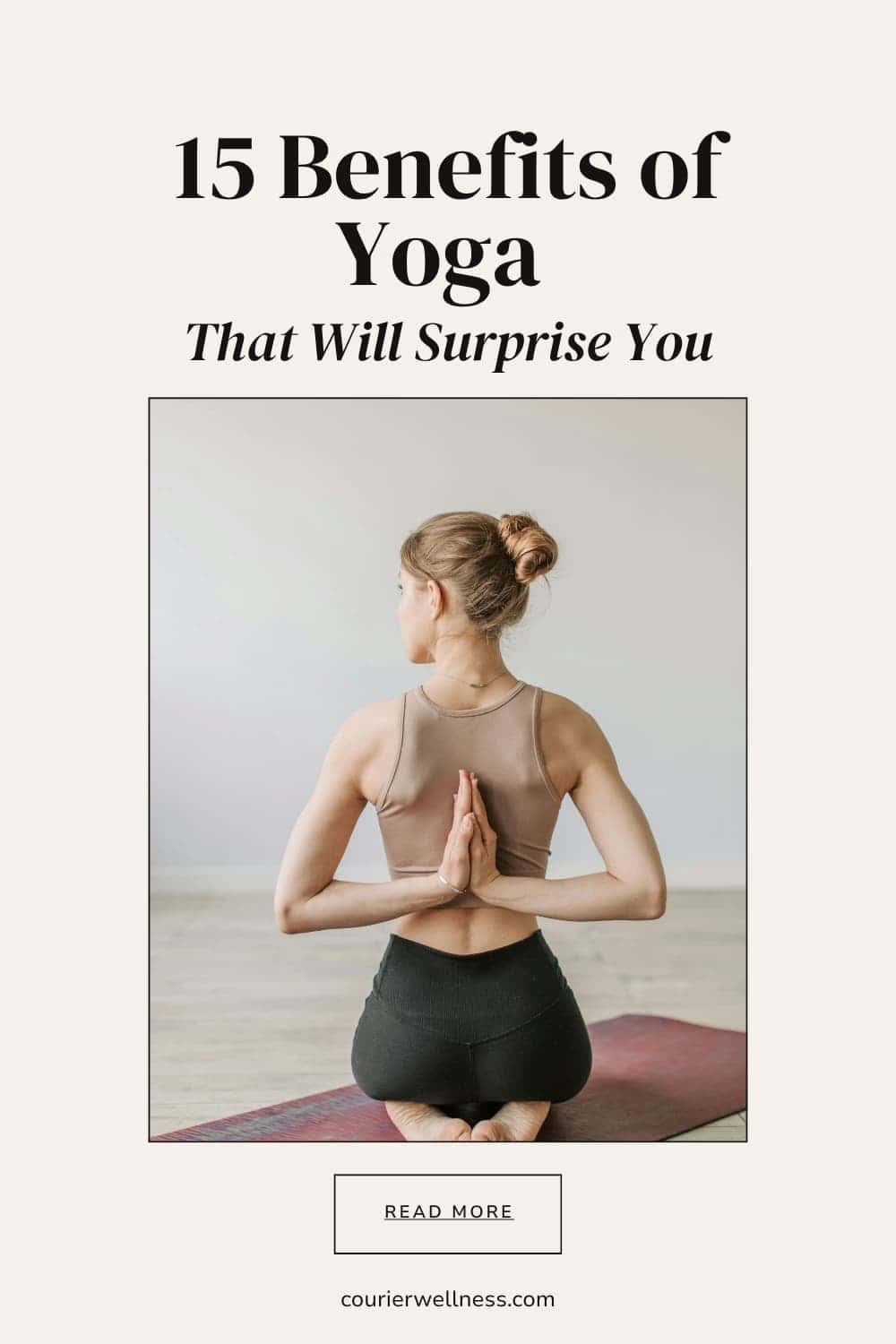 Woman kneeling on a yoga mat with hands clasped behind the back in a deep stretch.