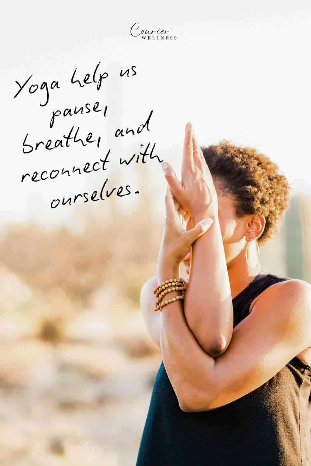 Woman in black tank top performing yoga pose in desert, expressing flow and yoga facts.